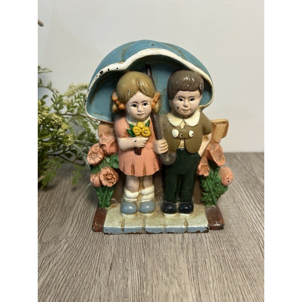 Vintage W.A Cast Iron Doorstop Boy & Girl With Flowers Umbrella